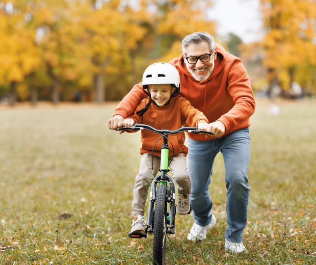 Man_and_boy_with_bike_landscape-1-1