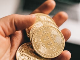 A Person Holding Bitcoins