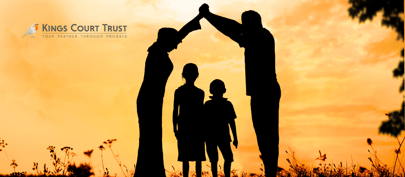 Parents creating a roof over their kids with joining hands