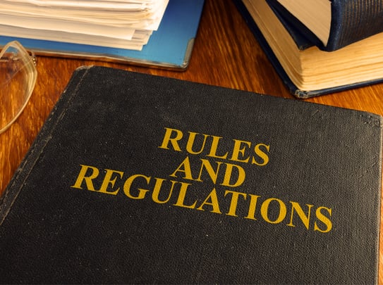 Black book with 'Rules and Regulations' on cover