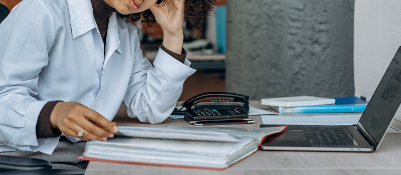 Woman reading documents at a desk