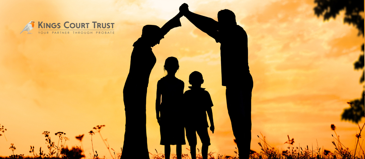 Parents creating a roof over their kids with joining hands